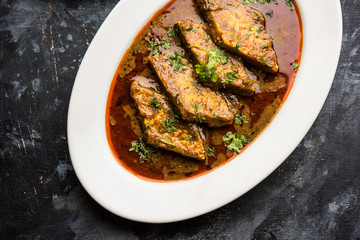 Patodi Rassa Bhaji or patwadi Sabji, a popular Maharashtrian spicy recipe served with Chapati and salad. Selective focus