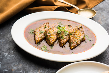 Patodi Rassa Bhaji or patwadi Sabji, a popular Maharashtrian spicy recipe served with Chapati and salad. Selective focus