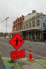 street in the city with red sign