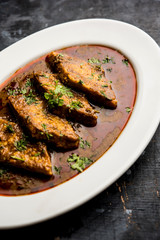 Patodi Rassa Bhaji or patwadi Sabji, a popular Maharashtrian spicy recipe served with Chapati and salad. Selective focus