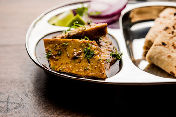 Patodi Rassa Bhaji or patwadi Sabji, a popular Maharashtrian spicy recipe served with Chapati and salad. Selective focus