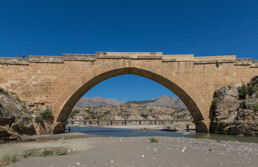 Mount Nemrut, Turkey - part of the Unesco World Heritage site of Mount Nemrut, the Severan Bridge is a example of roman architecture. Here in particular a look at the bridge and background landscape