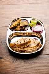 Patodi Rassa Bhaji or patwadi Sabji, a popular Maharashtrian spicy recipe served with Chapati and salad. Selective focus