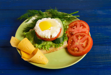 Fried eggs and pieces of vegetables on the table.