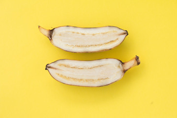 Sliced Yellow banana on yellow background © taira42