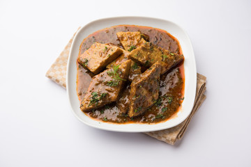 Patodi Rassa Bhaji or patwadi Sabji, a popular Maharashtrian spicy recipe served with Chapati and salad. Selective focus