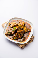 Patodi Rassa Bhaji or patwadi Sabji, a popular Maharashtrian spicy recipe served with Chapati and salad. Selective focus