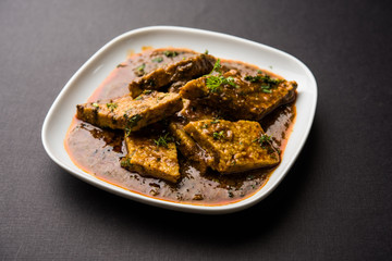 Patodi Rassa Bhaji or patwadi Sabji, a popular Maharashtrian spicy recipe served with Chapati and salad. Selective focus