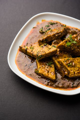 Patodi Rassa Bhaji or patwadi Sabji, a popular Maharashtrian spicy recipe served with Chapati and salad. Selective focus