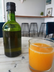 oil pan with orange juice glass