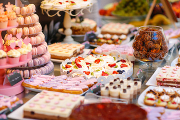 Delicious candy bar with cakes, cake pops, coucakes and other sweets