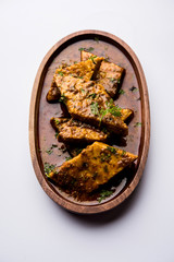 Patodi Rassa Bhaji or patwadi Sabji, a popular Maharashtrian spicy recipe served with Chapati and salad. Selective focus