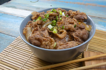 Cooked beef with rice on bowl