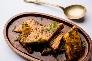 Patodi Rassa Bhaji or patwadi Sabji, a popular Maharashtrian spicy recipe served with Chapati and salad. Selective focus