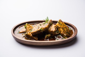Patodi Rassa Bhaji or patwadi Sabji, a popular Maharashtrian spicy recipe served with Chapati and salad. Selective focus