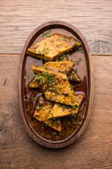 Patodi Rassa Bhaji or patwadi Sabji, a popular Maharashtrian spicy recipe served with Chapati and salad. Selective focus