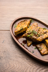 Patodi Rassa Bhaji or patwadi Sabji, a popular Maharashtrian spicy recipe served with Chapati and salad. Selective focus