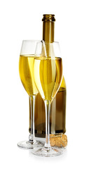 Two glasses of champagne on the background of brown bottles close-up isolated on a white.