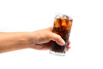 Glass of drink cola with ice in hand on white background