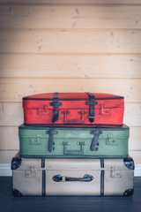Vintage colourful pile of suitcases, travel luggage concept
