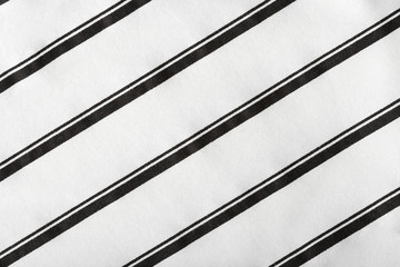 Black and white striped cotton fabric. The texture of cotton fabric.