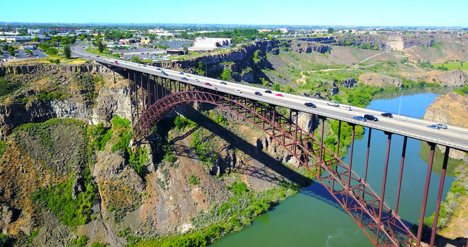 Perrine Bridge, Twin Falls, Idaho, USA - Distant Aerial View Over River Canyon With Cars Driving On Road