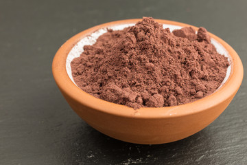 bowl of aronia berry powder