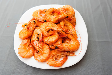 Boiled shrimps on a white plate.