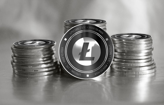Litecoin (LTC) digital crypto currency. Stack of black and silver coins. Cyber money.