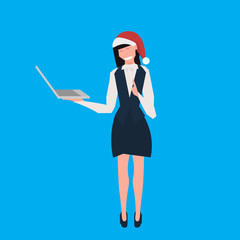 businesswoman wearing santa red hat using laptop female cartoon character full length blue background flat vector illustration