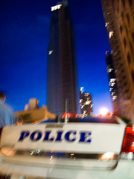 Police car on street in blur