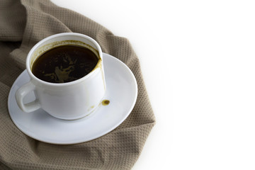 coffee cup on cloth napkin isolated on white background
