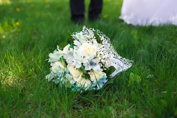Wedding bouquet in the grass. Wedding concept