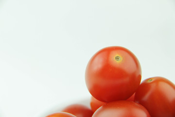 Cherry tomatoes on white background