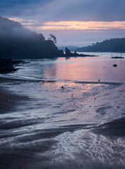 Sun rise on a misty morning looking through the inlet