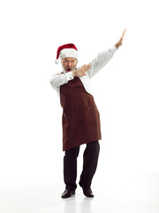 Portrait of Man in Santa Claus Costume - with a Luxurious White Beard, Santa's Hat and a Red Costume at red studio background