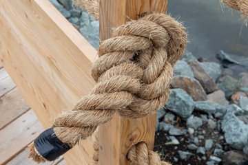 rope with knot on wooden post