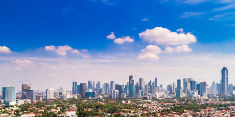 Fototapeta premium Aerial View of Jakarta Cityscape with Blue Sky