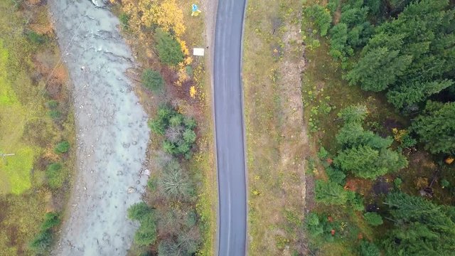 Aerial view of the mountain road and the river Prut. Carpathians. Ukraine. Top view
