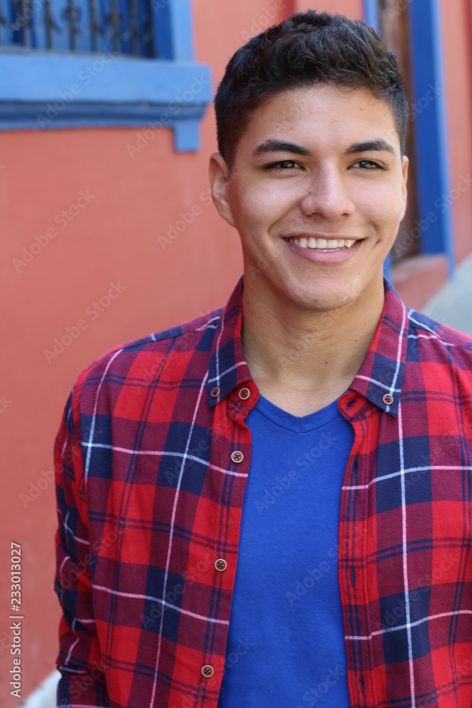 Wall mural Healthy ethnic guy smiling headshot