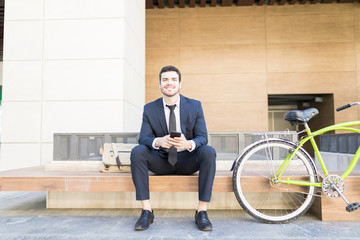 Young Urban Professional Businessman Using Mobile Phone