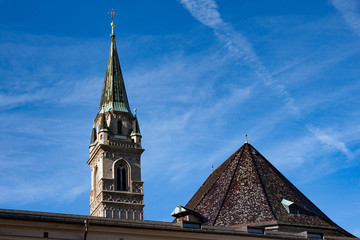 Tower of Franciscan Church against blue sky. Salzburg, Austria.