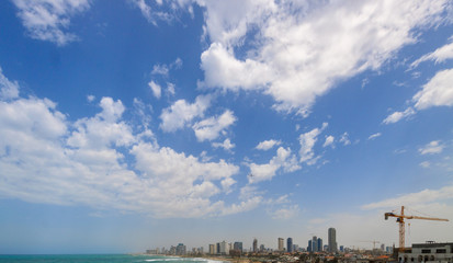 Sky with clouds over a wide panorama of Tel Aviv