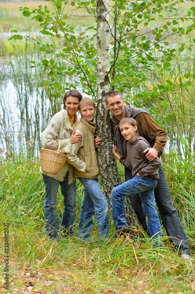 Poster portrait of family of four in park