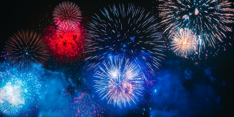 Colorful fireworks explosion on the black background