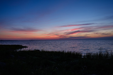 red saturated colors in sunset over the sea