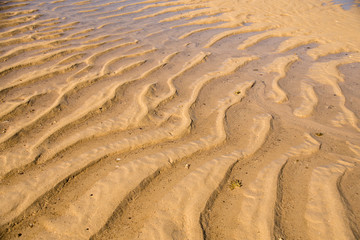 Patterns in the sand at low tide