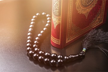 Islamic Book Koran with rosary on background © BillionPhotos.com