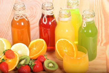 juices with various fruit in glass bottles with free space for text