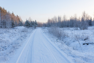 Snow dirt road at countryside Finland winter